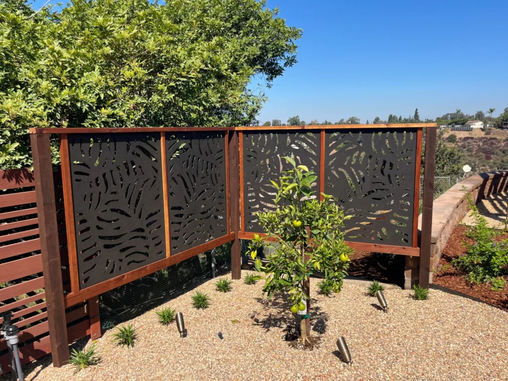 Front view of redwood-framed OutDeco screen used for privacy.